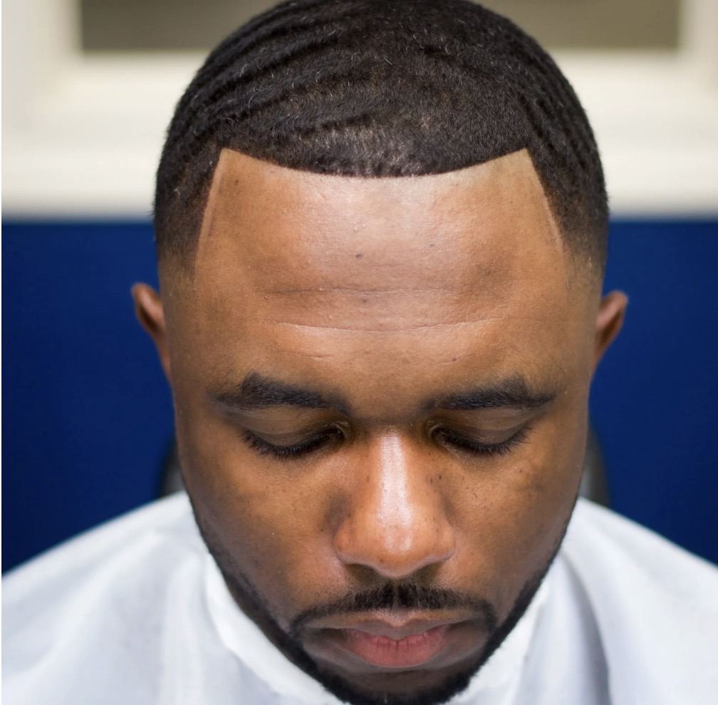 Natural wave haircut and lineup by Premium Fade League in Austin