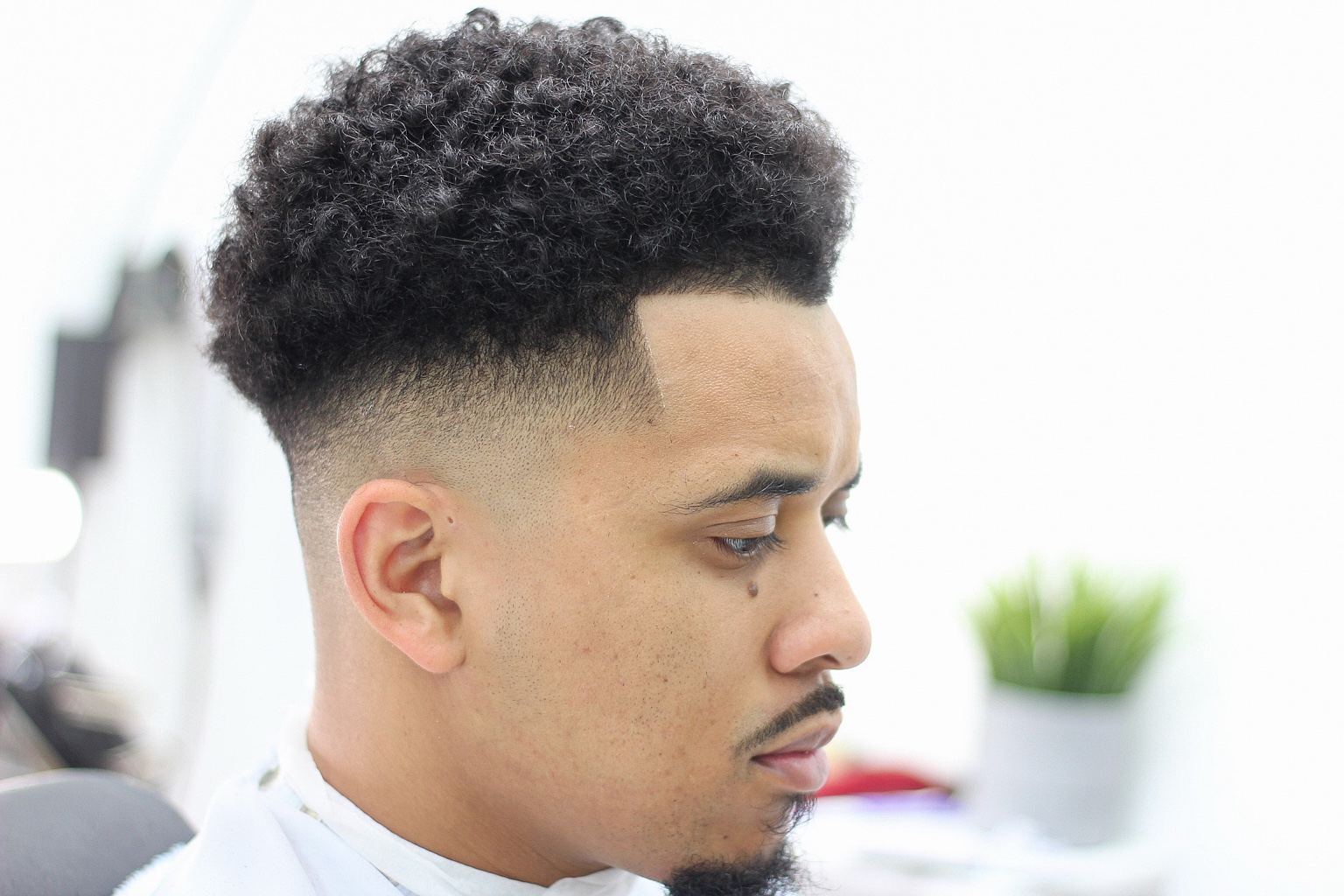 Curly textured fade by Premium Fade League